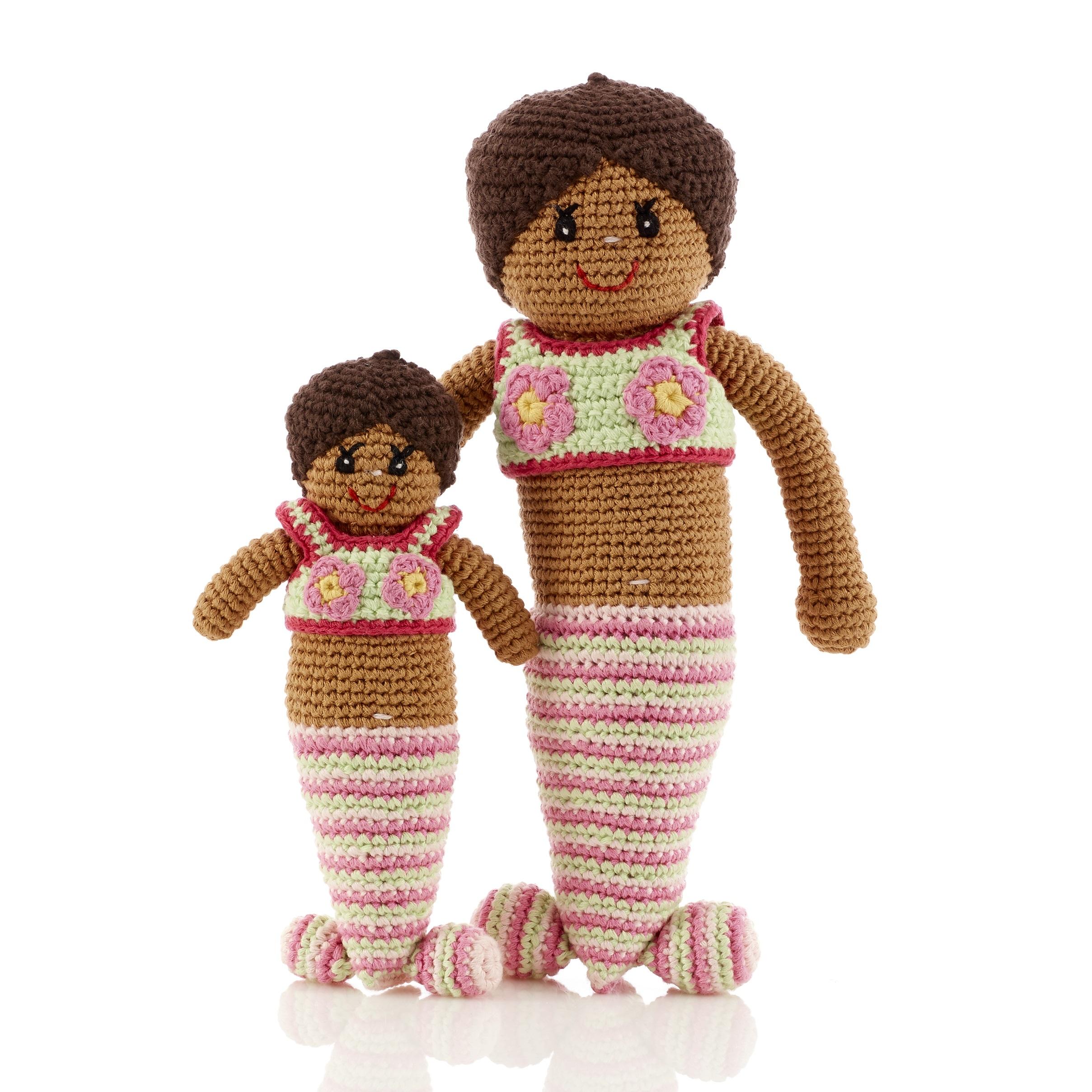 Handmade crochet mermaid soft dolls, one large and one small both with pink and cream tails and bikinis and dark skin